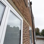 Commercial white windows installed by First Windows close up view of product