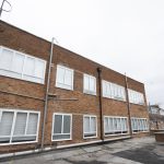 Commercial white windows installed by First Windows roof shot