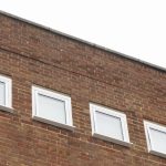 Commercial white windows installed by First Windows looking from below