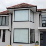 Home Owners with windows installed close up