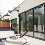 First Windows project closed sliding doors with deck chair