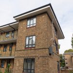 Cedar House Commercial black windows installed by First Windows corner shot