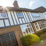 Frist Windows installed on traditional Residential building with garage
