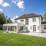 White uPVC windows and doors installed by First Windows outside view with garden