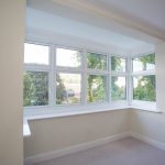 White uPVC windows installed by First Windows inside view of bedroom