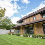 Patio doors and windows installed on modern 3 story house